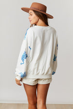 Fantastic Fawn White pullover sweatshirt with sequin aqua blue tiger print