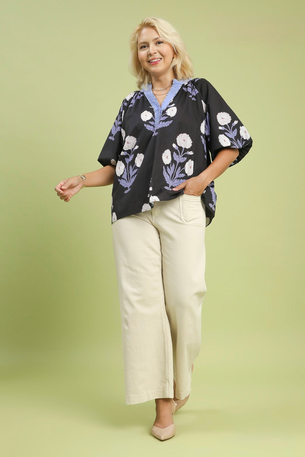 Women's Umgee black top with light blue and cream floral print in plus size showing full front view.