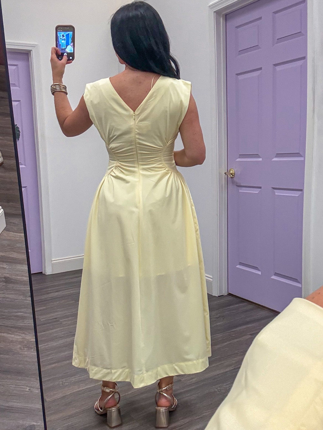 back view of yellow fitted midi dress
