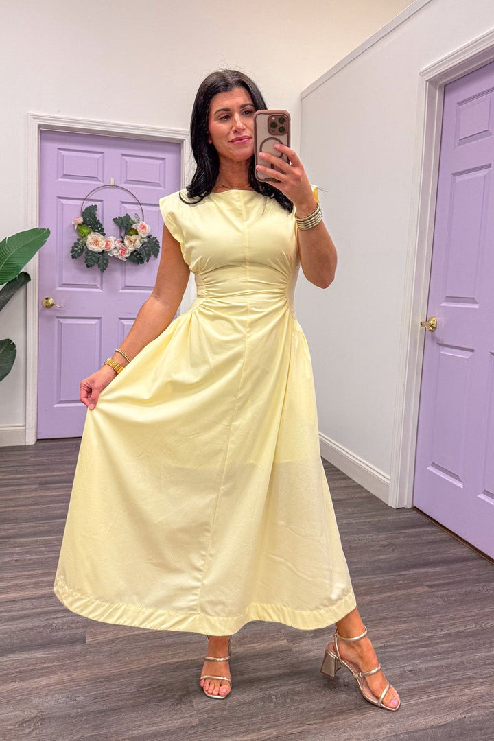 Butter yellow midi dress with fitted bodice and flowy skirt