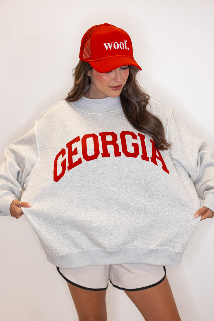 Women's "Georgia/GA" sweatshirt in reversible grey and red or white and red by BucketList showing oversized fit of heather grey side