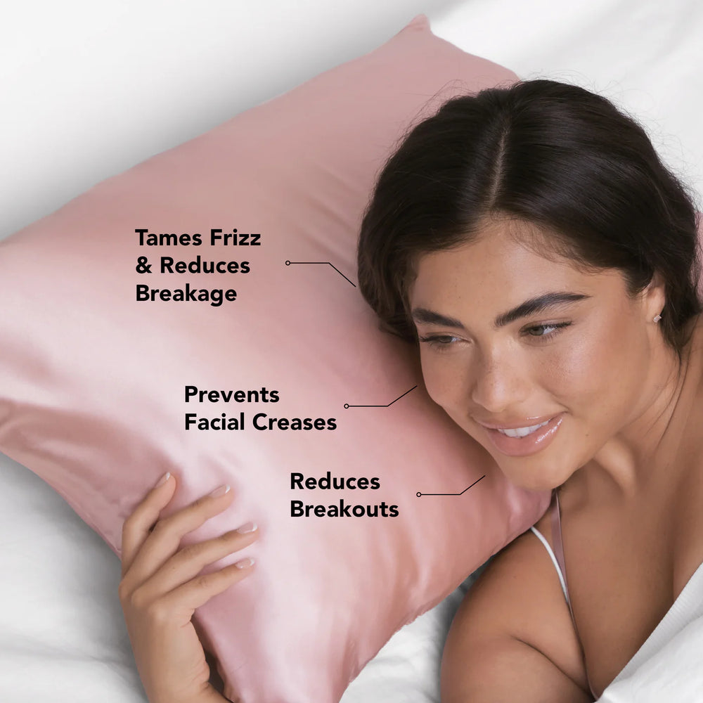 Woman lying on a pink satin pillow