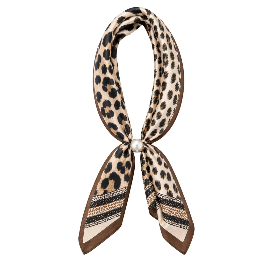 Leopard print scarf necklace with a pearl accent on a 