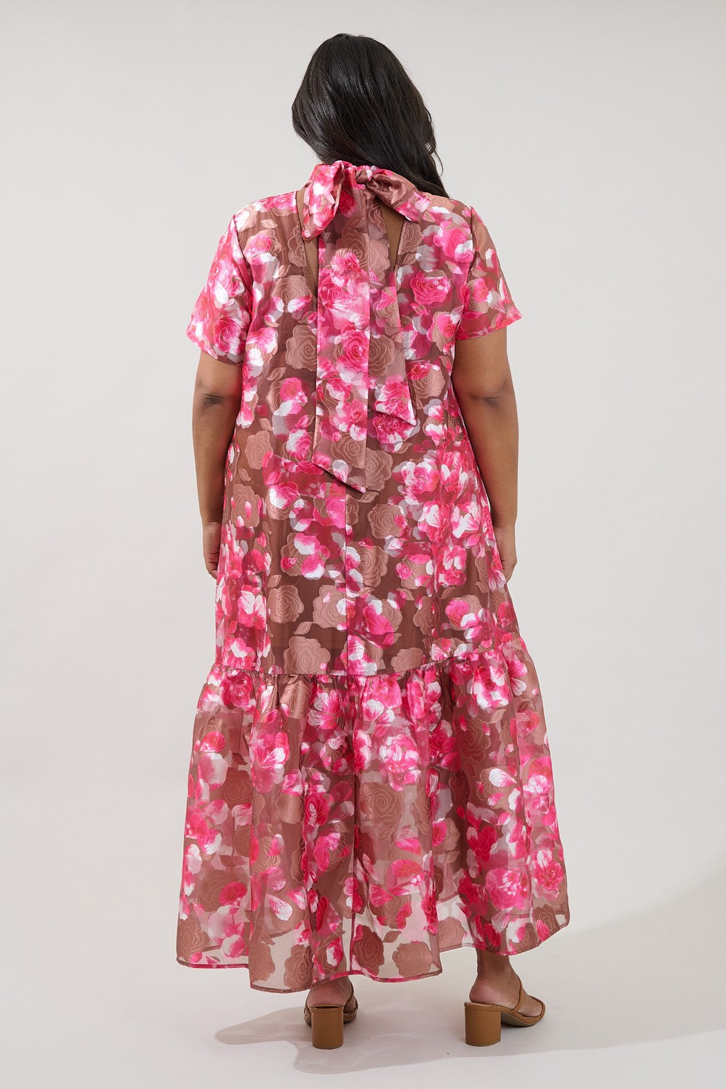 Plus size pink and brown textured floral print maxi dress with tie detail in back in a flattering fit
