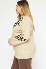 Plus size off white sweater with black stitched floral print