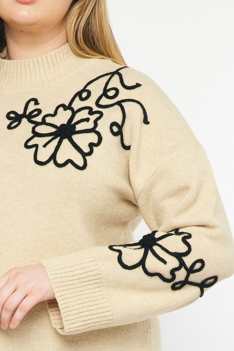Plus size off white sweater with black stitched floral print