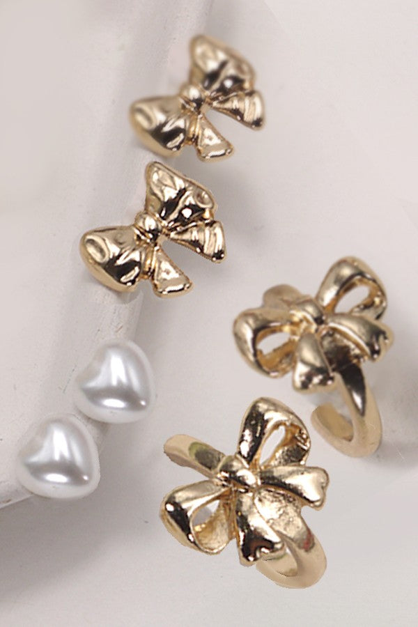 set of 3 gold pearl and bow earrings