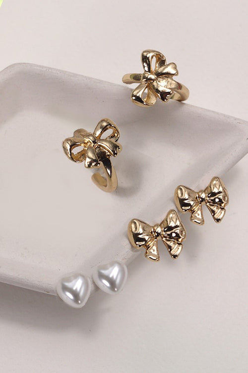 set of 3 gold pearl and bow earrings