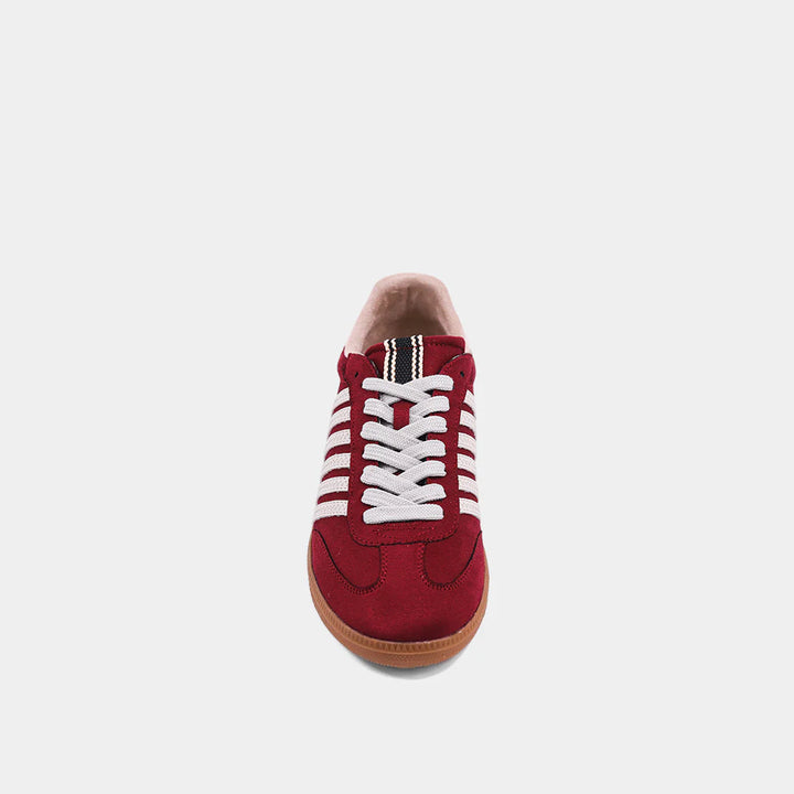 Shu Shop Stevie burgundy sneaker with white stripes, showing top view