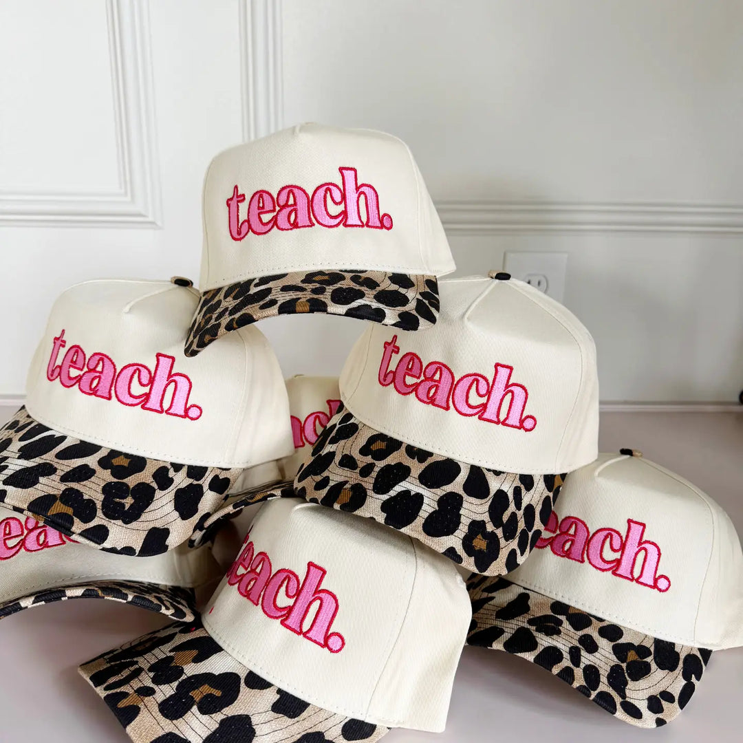 Women's leopard print  and pink "Teach" trucker hat.