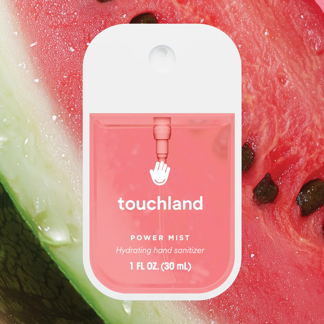 Touchland power mist hand sanitizer packaging on a watermelon background