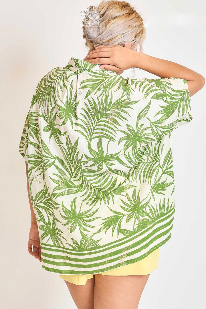 Umgee Plus cream top with green palm tree print accented with metallic gold