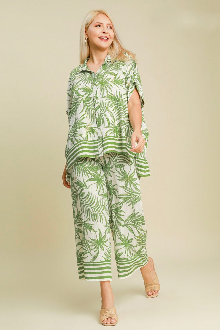 Umgee Plus cream top with green palm tree print accented with metallic gold