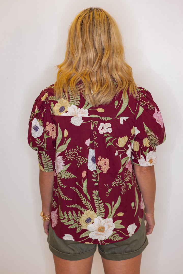 Women's burgundy multicolor floral print button front top by Entro showing back view