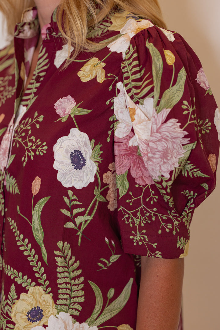 Women's burgundy multicolor floral print button front top by Entro showing puff sleeves
