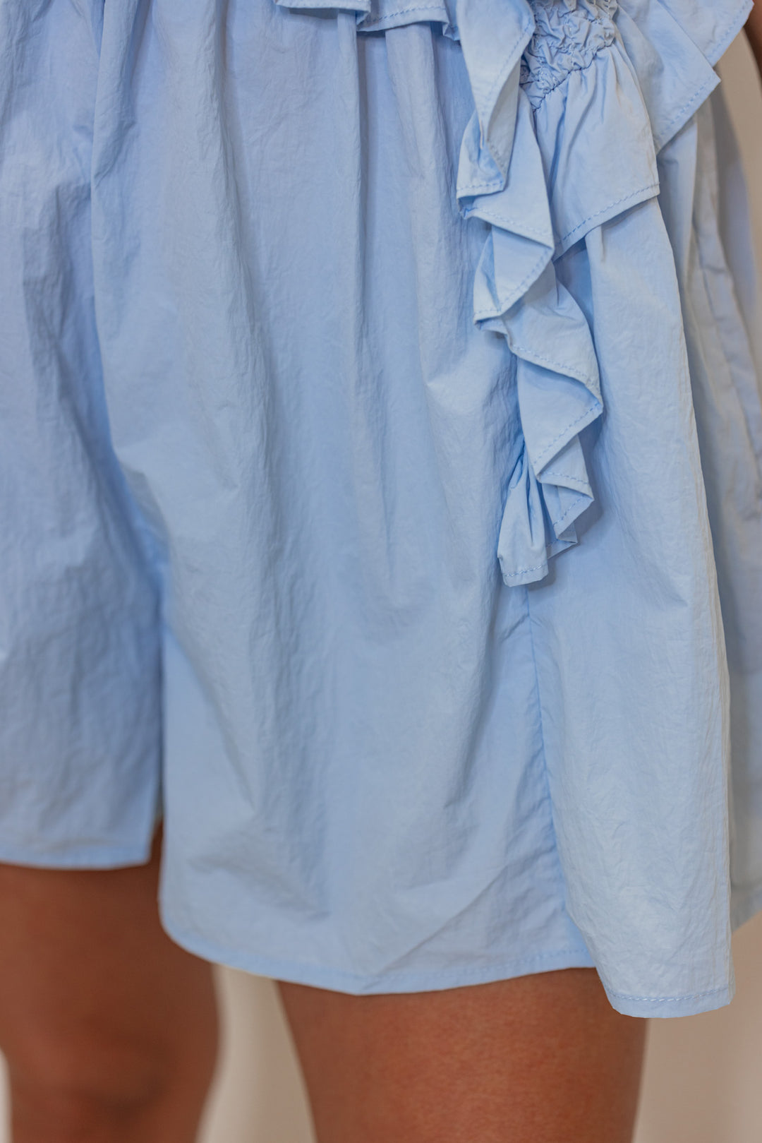 baby blue smocked chest flowy leg romper
