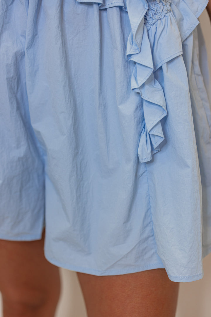 baby blue smocked chest flowy leg romper