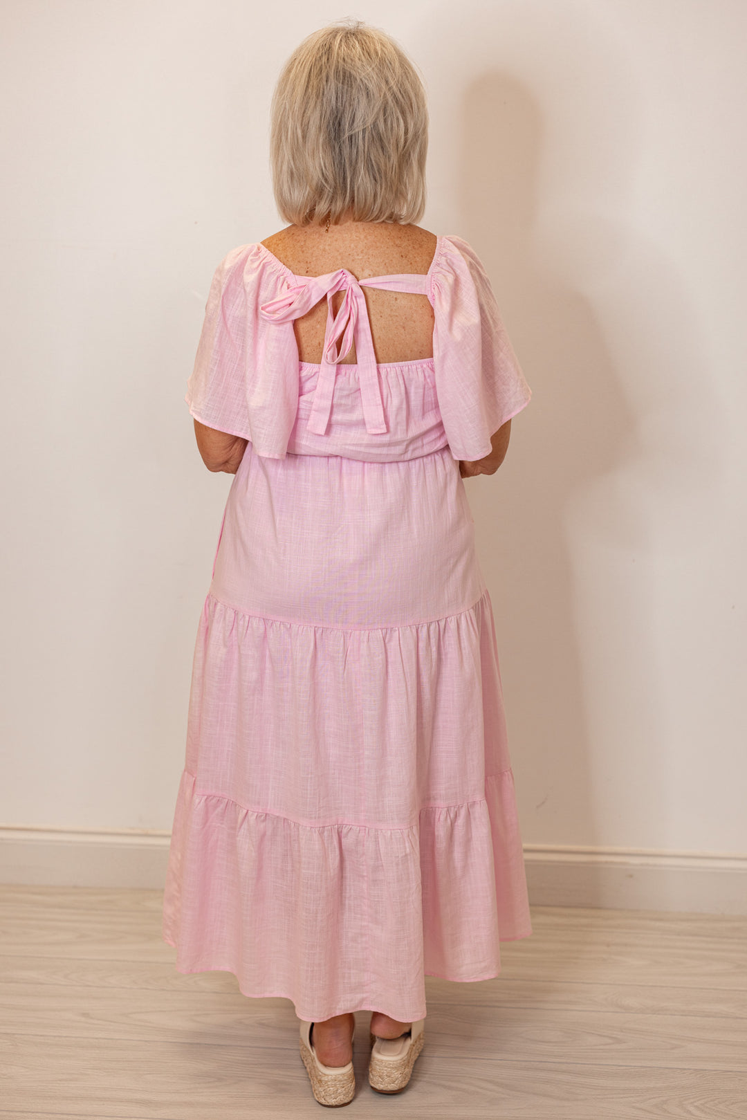 pale pink embroidered floral tiered midi dress