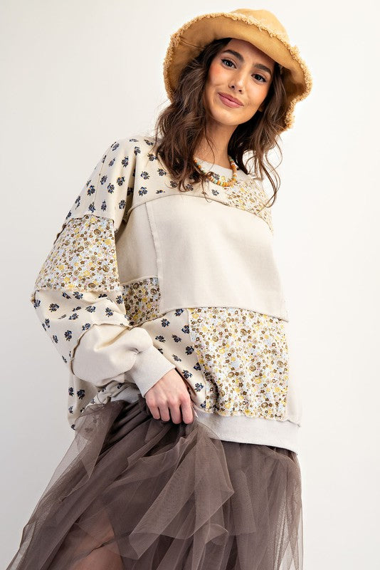 Women's beige french terry knit pullover top with patchwork floral print by easel