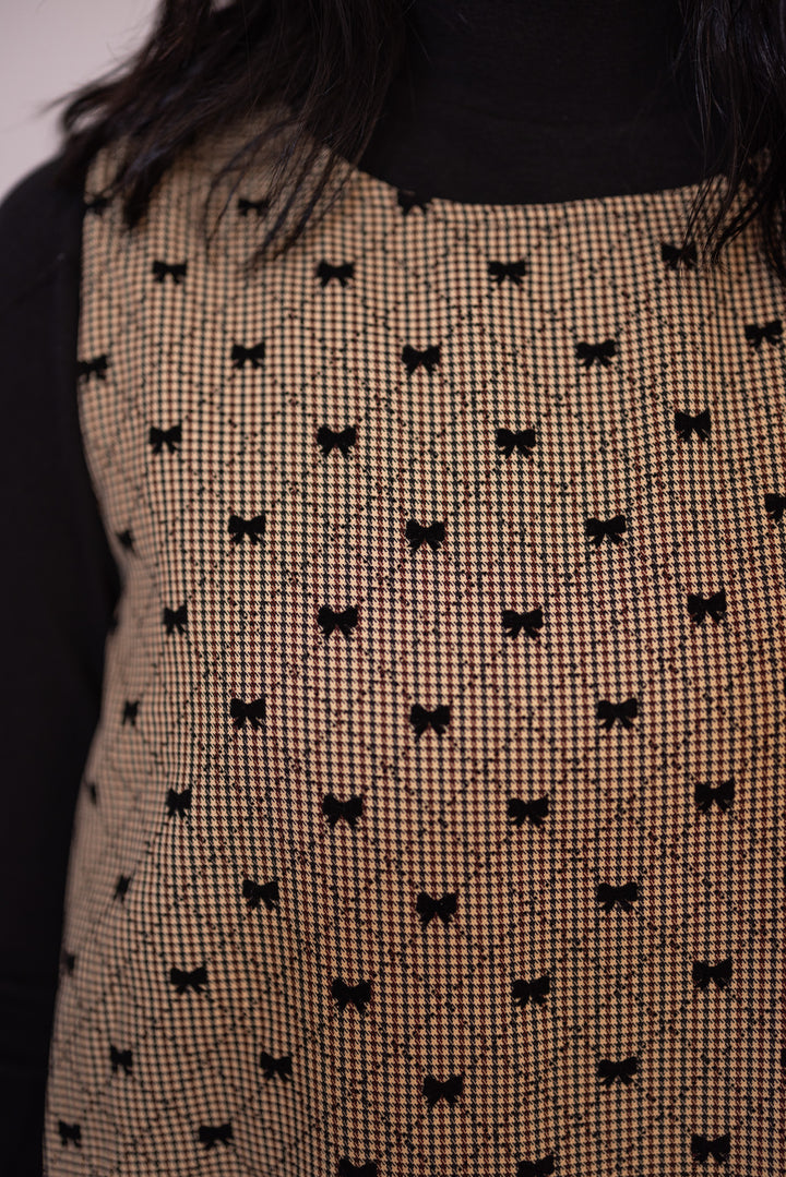 Women's brown, taupe and black gingham bubble hem dress with black bow ties by Glam showing close look at bow details