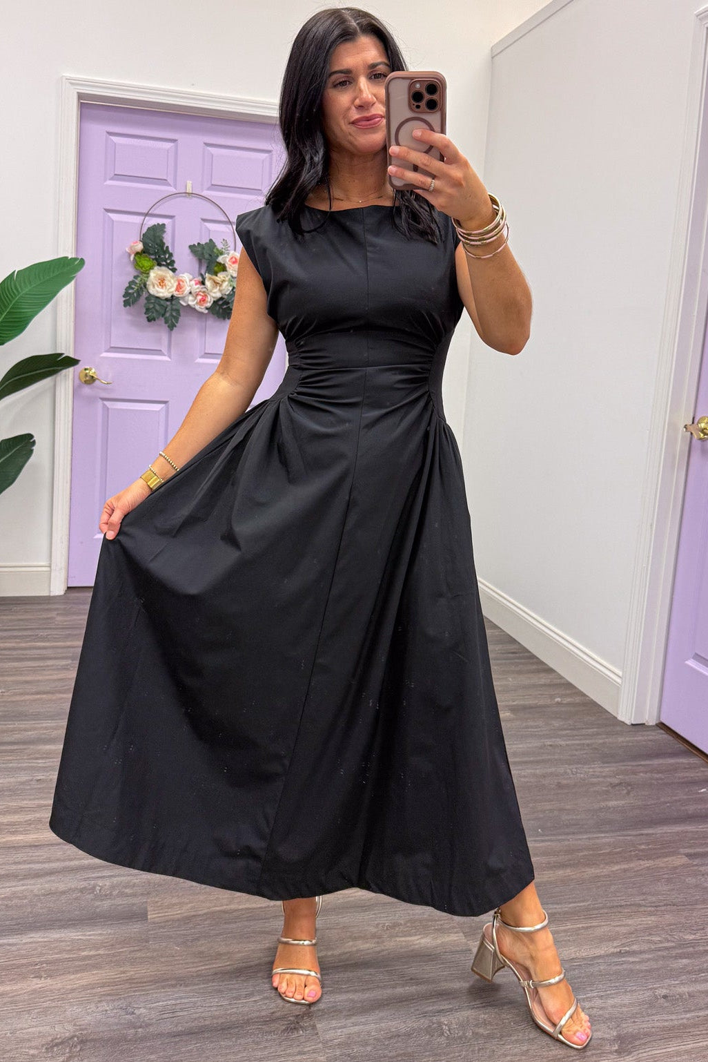 black ruched side panel cinch waist sleeveless midi dress with flowy skirt