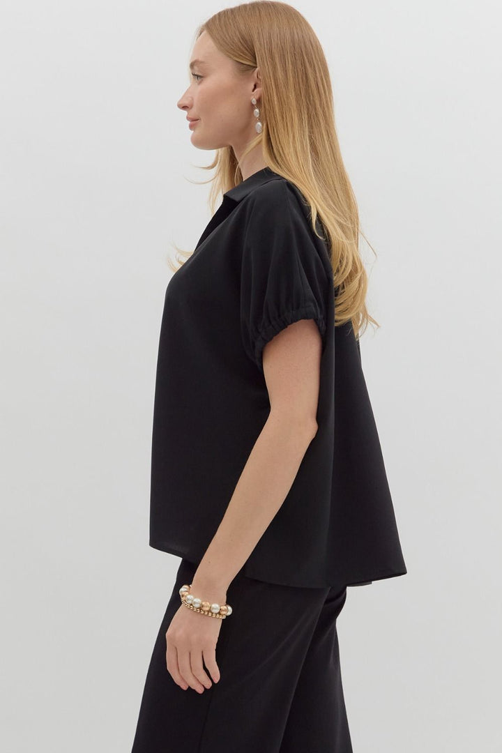 Women's black short sleeve top by Entro showing side view