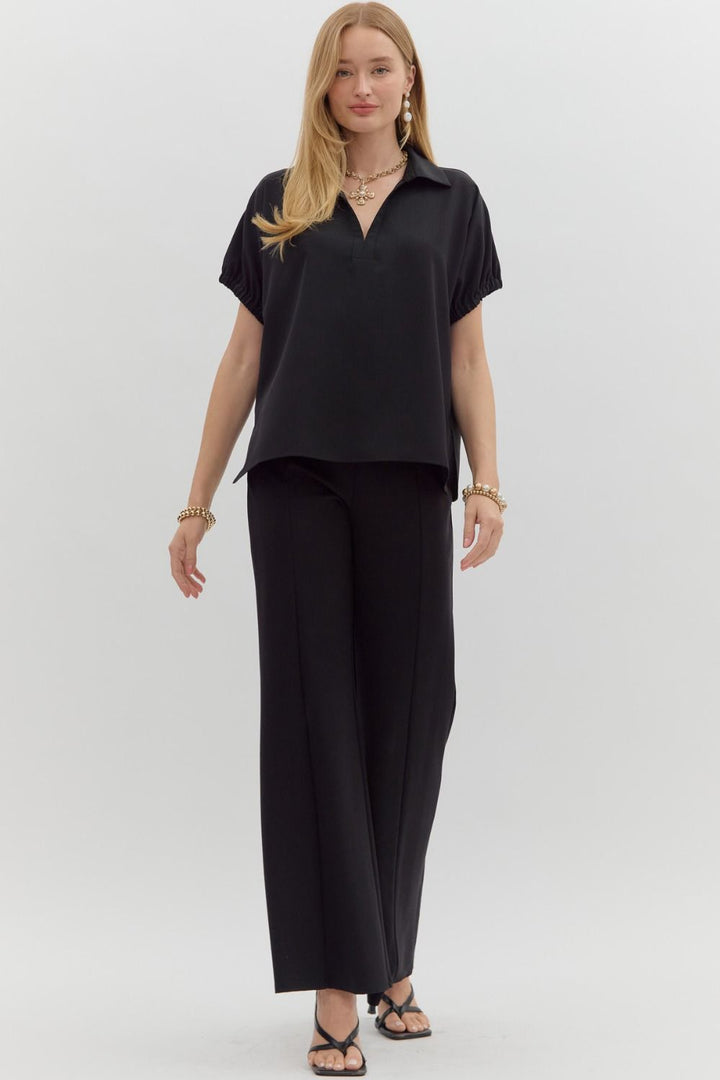 Women's black short sleeve top by Entro showing full front view