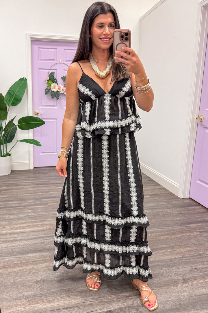 black with cream embroidered striped details sleeveless ruffle hem peplum top