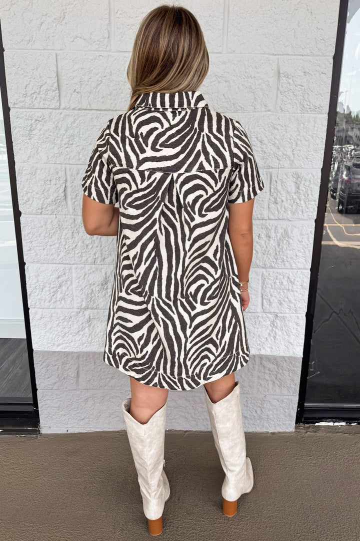 black and cream zebra print short sleeve button front bodice denim dress with back gathered detail