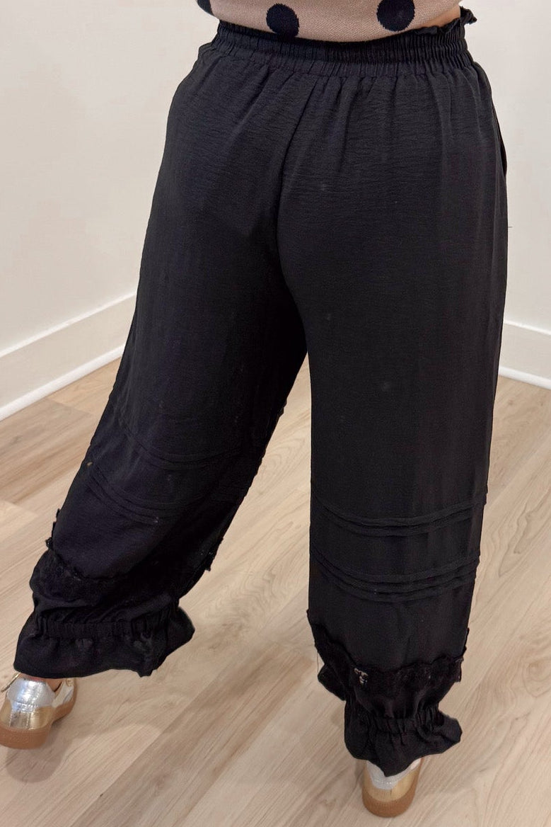 solid black elastic waist flowy wide leg cropped pants with elastic ruffle cuffed ankles