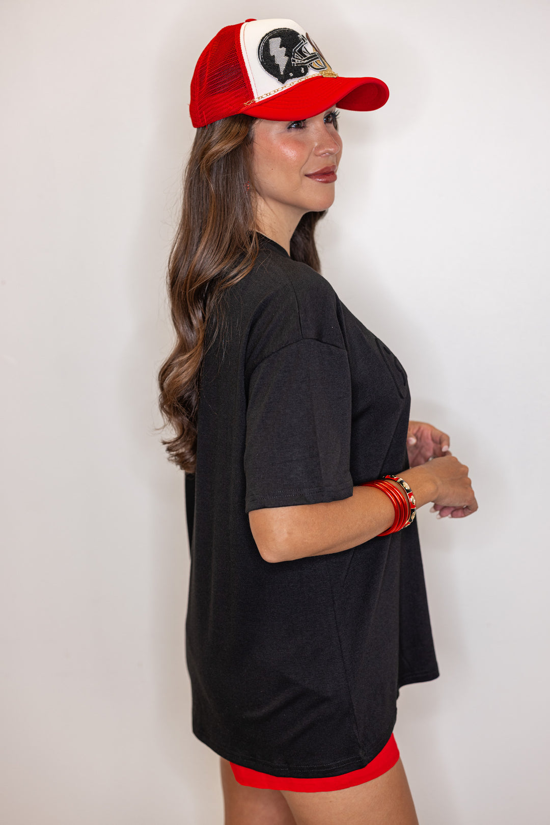 Women's black lightweight top with embossed 'Go Team' in center by Jess Lea showing up close side view