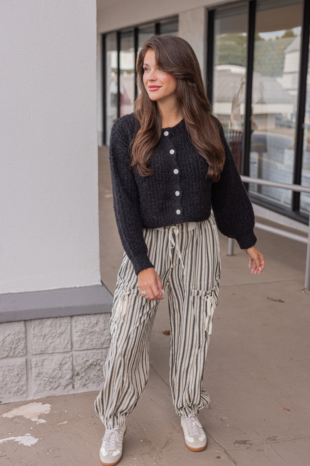 Women's trendy black fuzzy knit textured button front sweater cardigan by hyfve  shown with a casual outfit