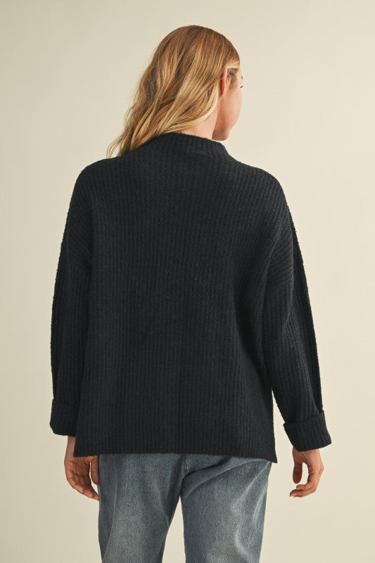 Women's black ribbed knit mock neck sweater top with side slits by Mustard Seed showing back view