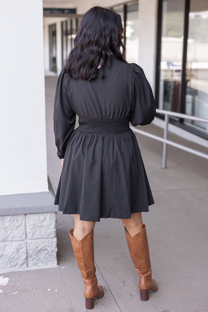 Women's black dress with zipper front closure by Umgee showing full back view