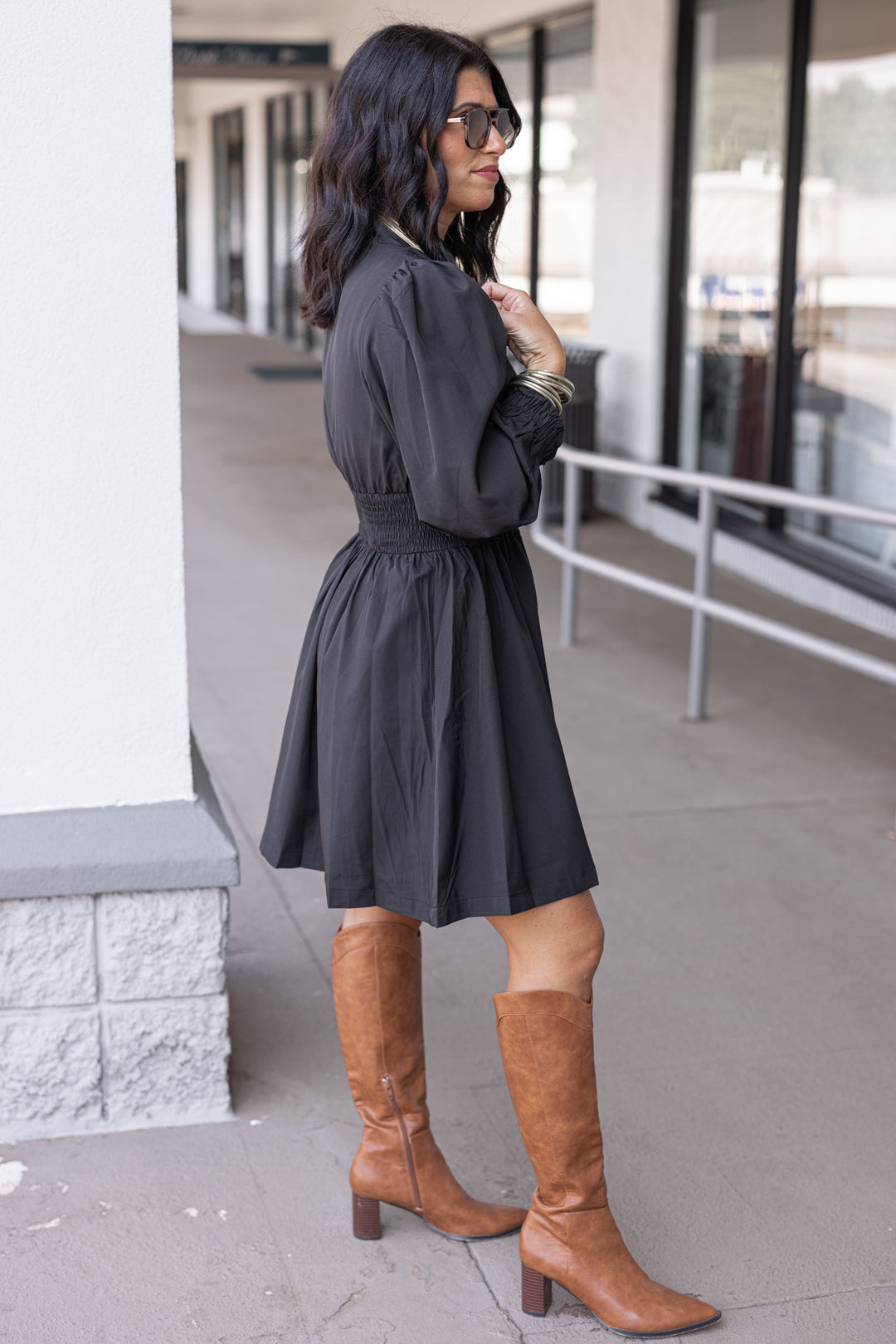 Women's black dress with zipper front closure by Umgee showing full side view