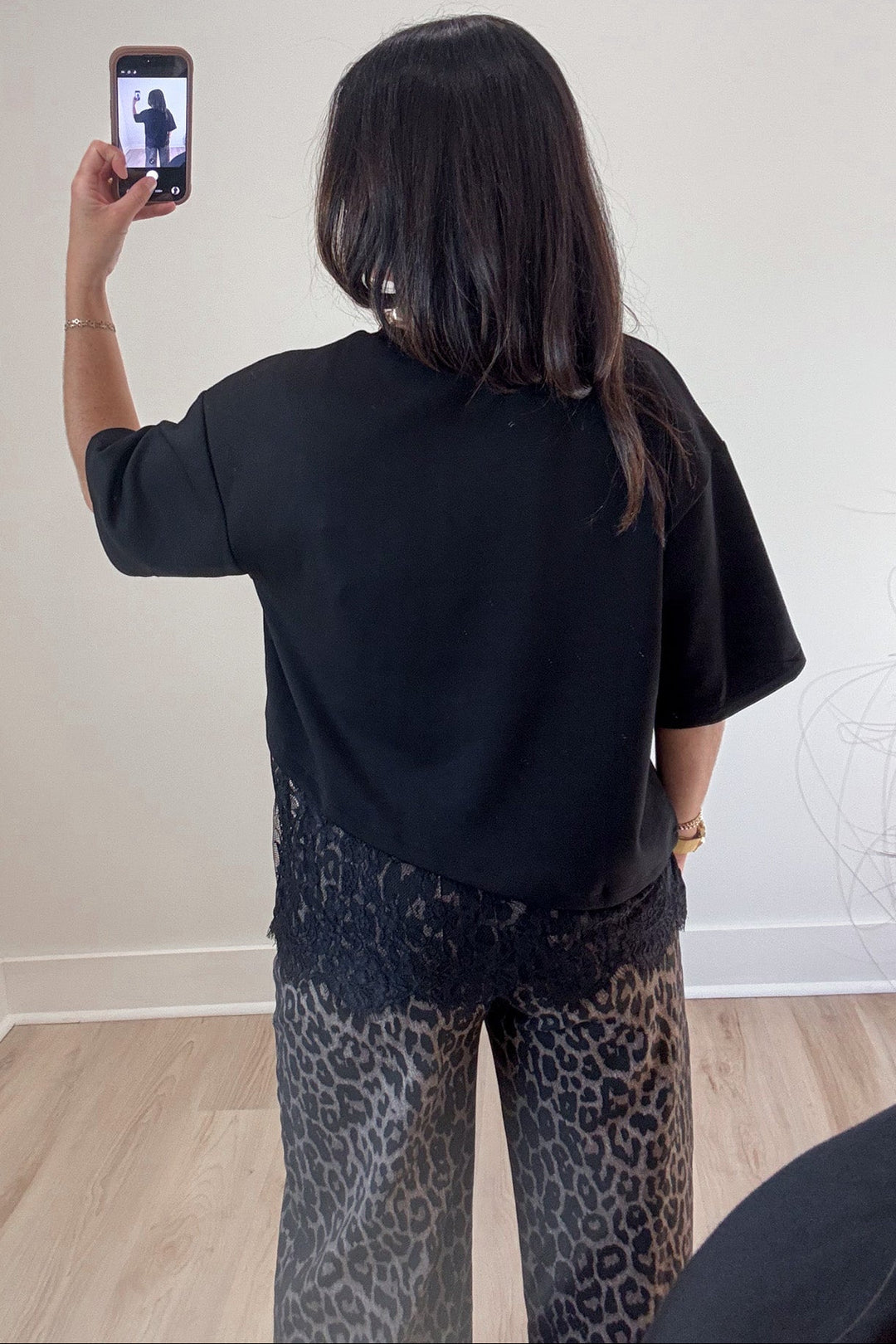 solid black scalloped hem short sleeve crew neckline top with asymmetrical lace detail