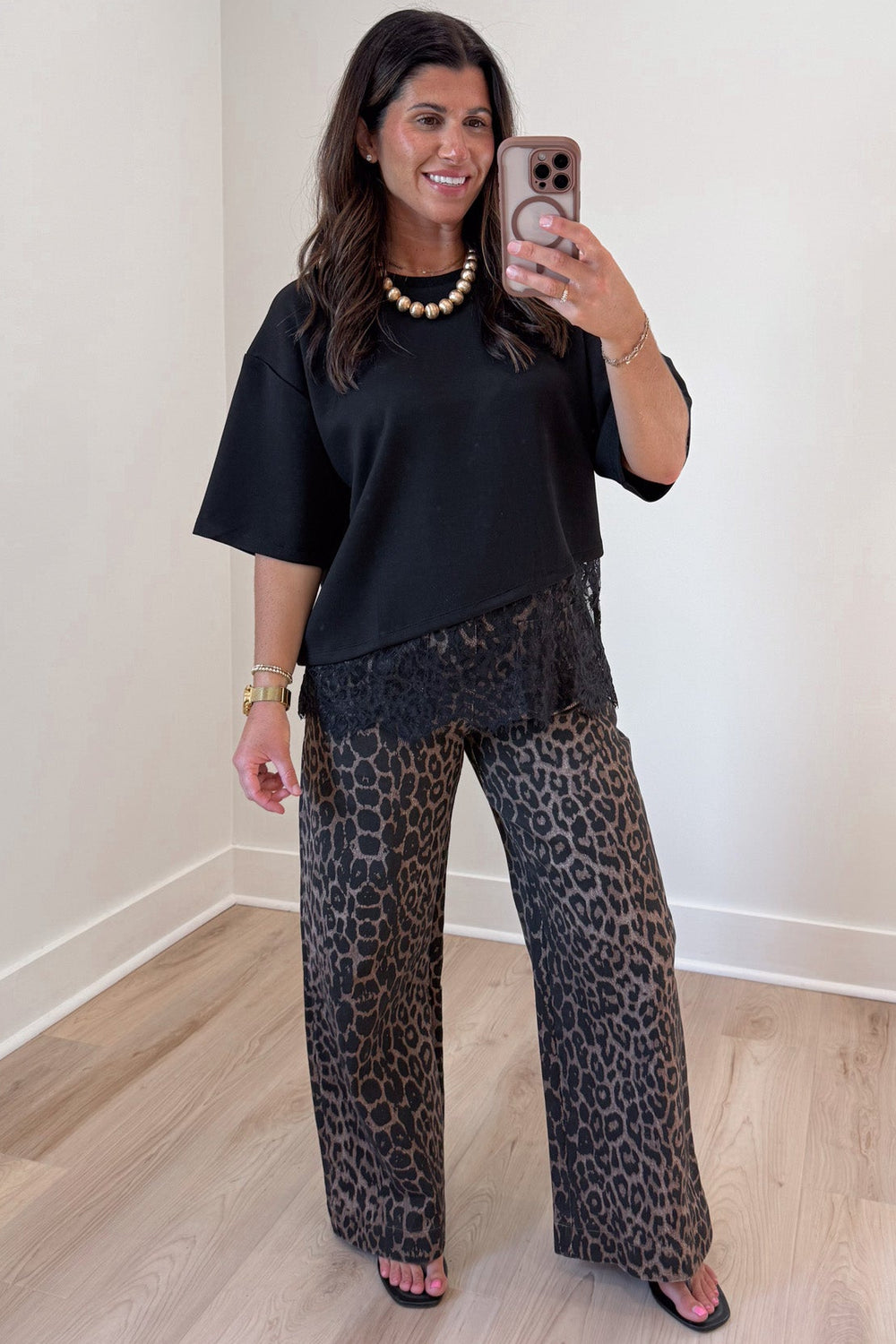 solid black asymmetrical tiered lace hem short sleeve crew neckline lightweight top