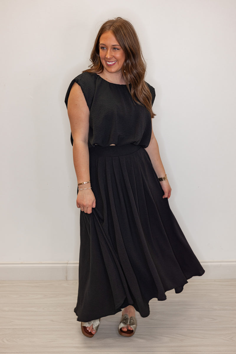 dressy black bubble hem top