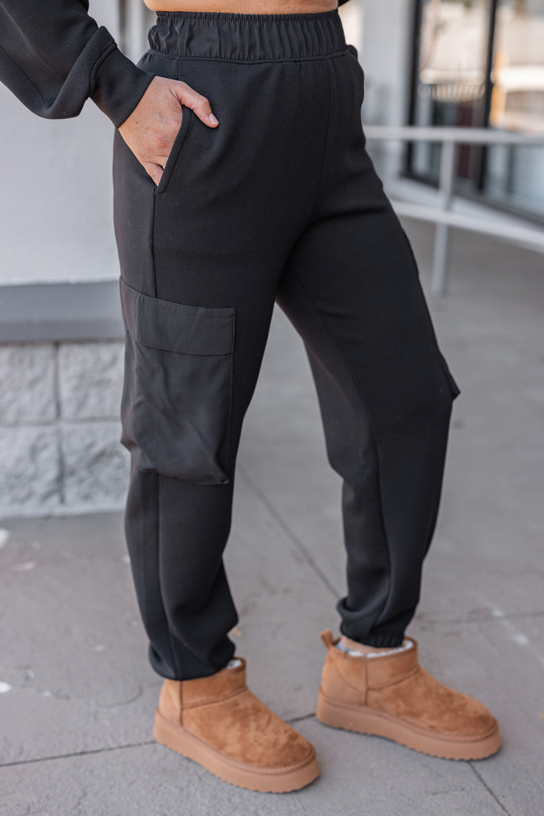 Women's black scuba luxe knit jogger pants with raw/reverse seam details by Umgee