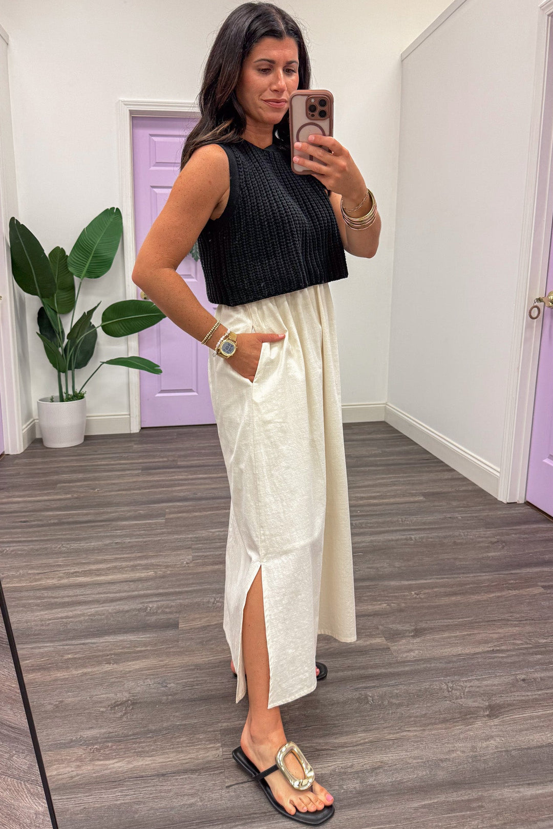 midi dress with black sweater top and cream side pocket cotton skirt