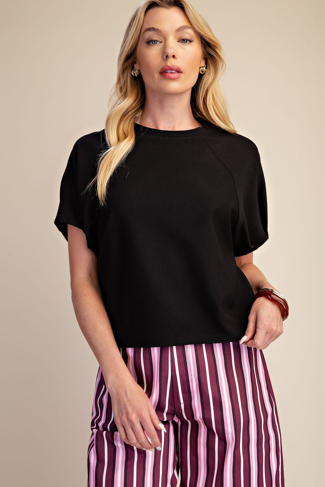 Black ribbed knit top with gathered puff sleeves by glam