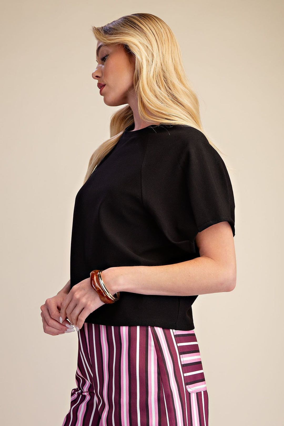 Black textured knit crop top with gathered puff sleeves