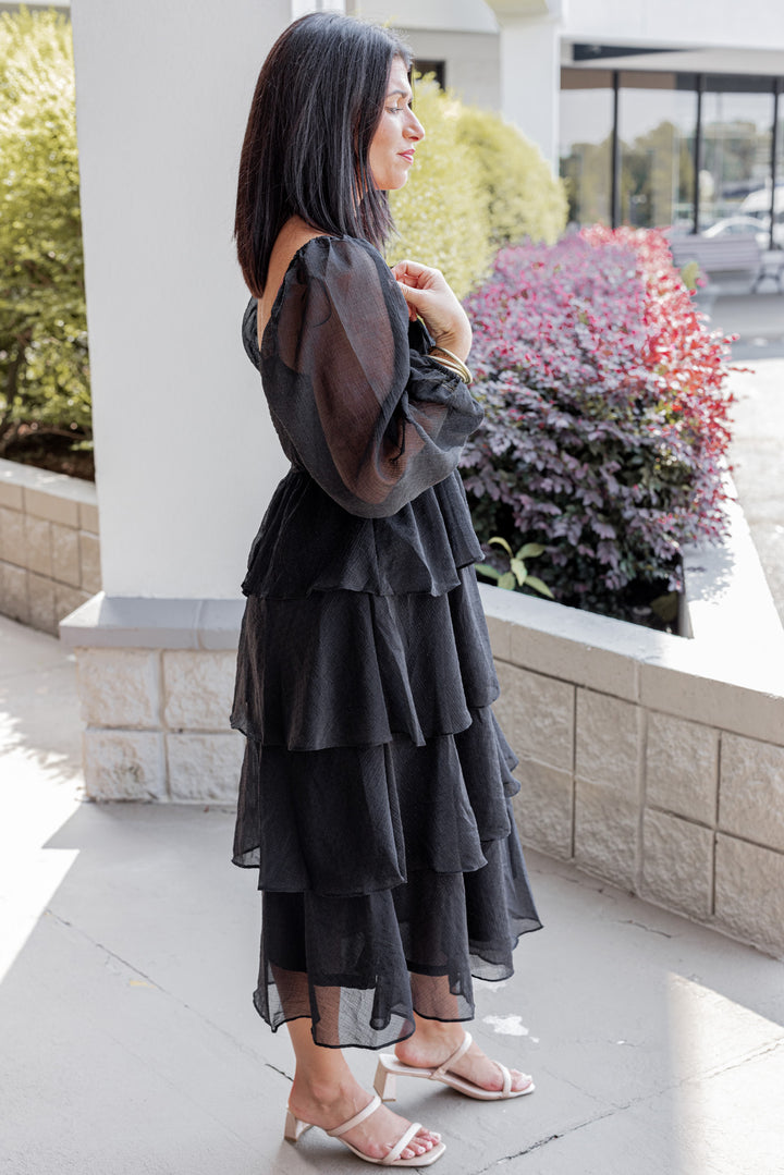 Women's black ruffle layer tiered midi dress with black shimmering details by Blu Pepper showing full side view
