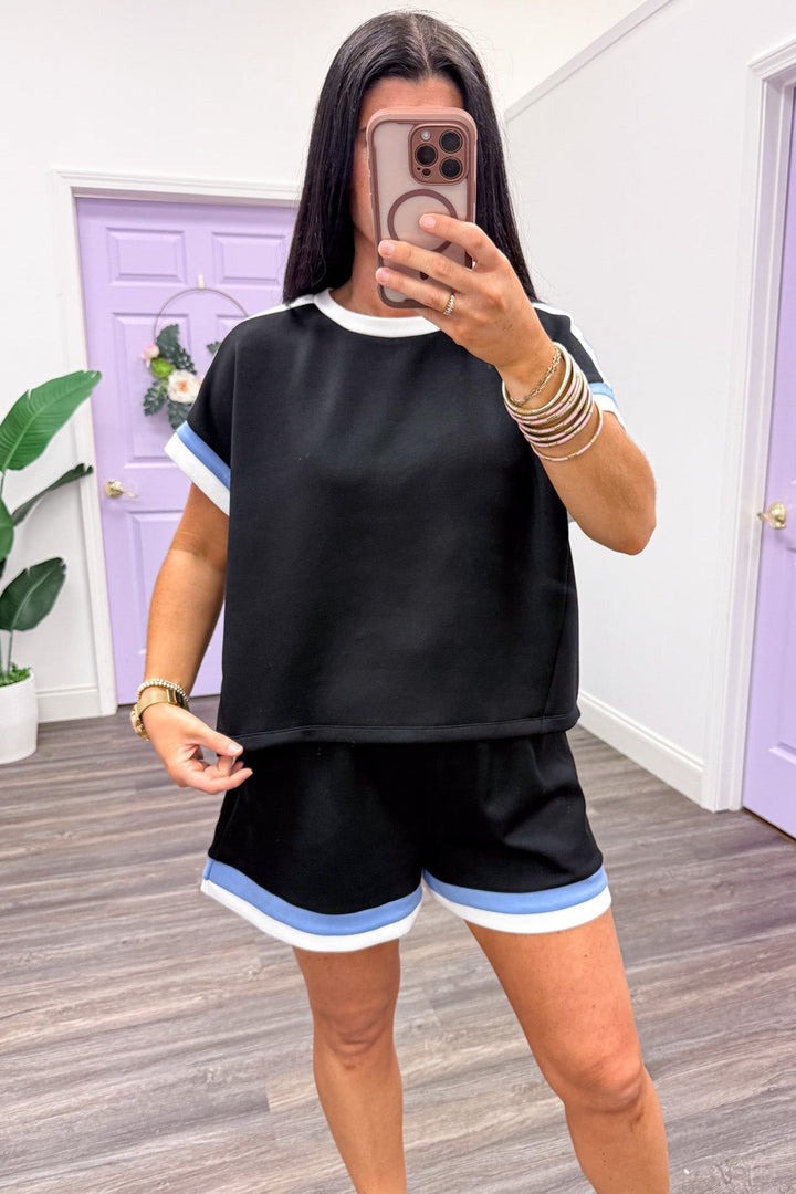 white and blue trimmed scuba knit crew neckline black top