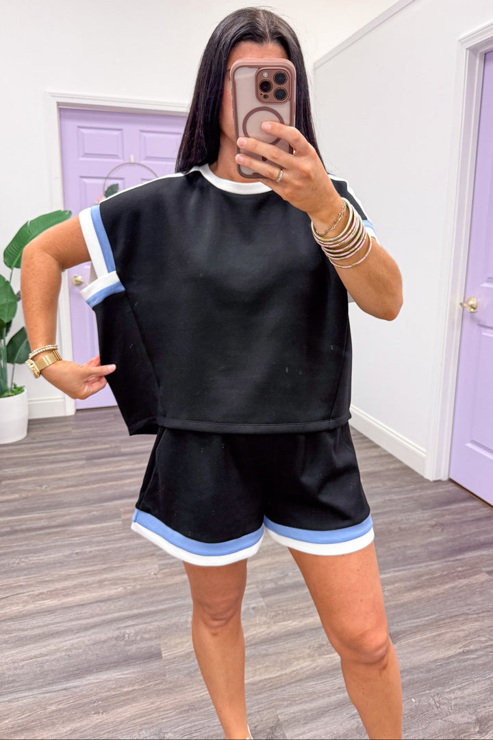 white and blue trimmed scuba knit black top relaxed silhouette