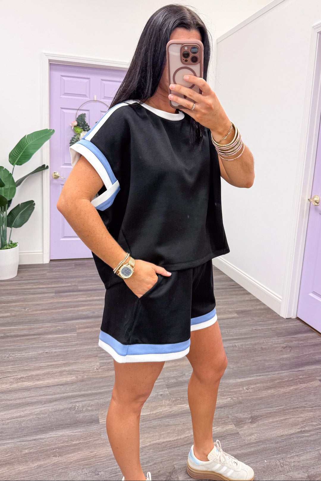 white and blue trimmed scuba knit short sleeve drop shoulder black top