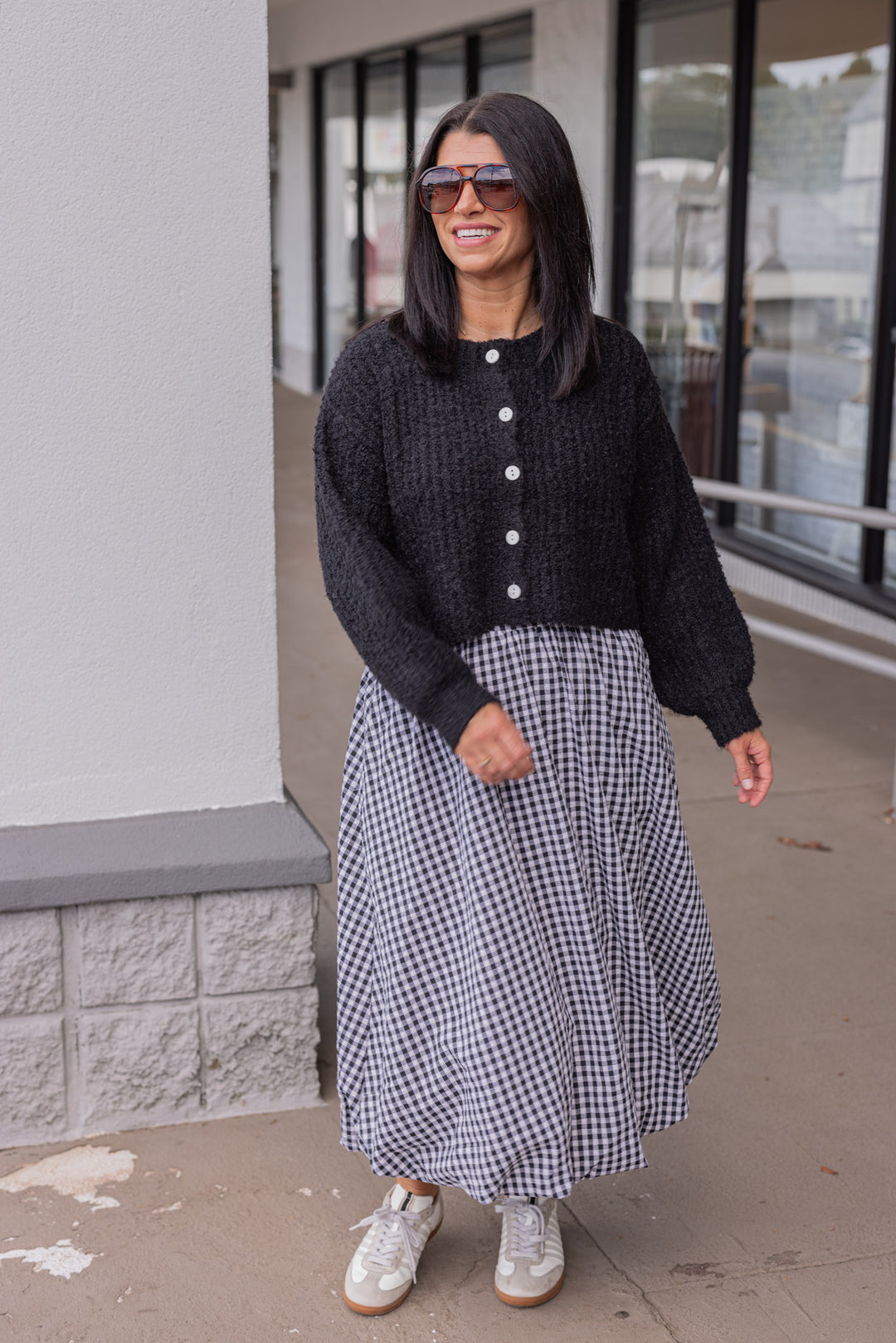 Women's black and white gingham textured midi skirt with bubble hem by Easel showing full front view