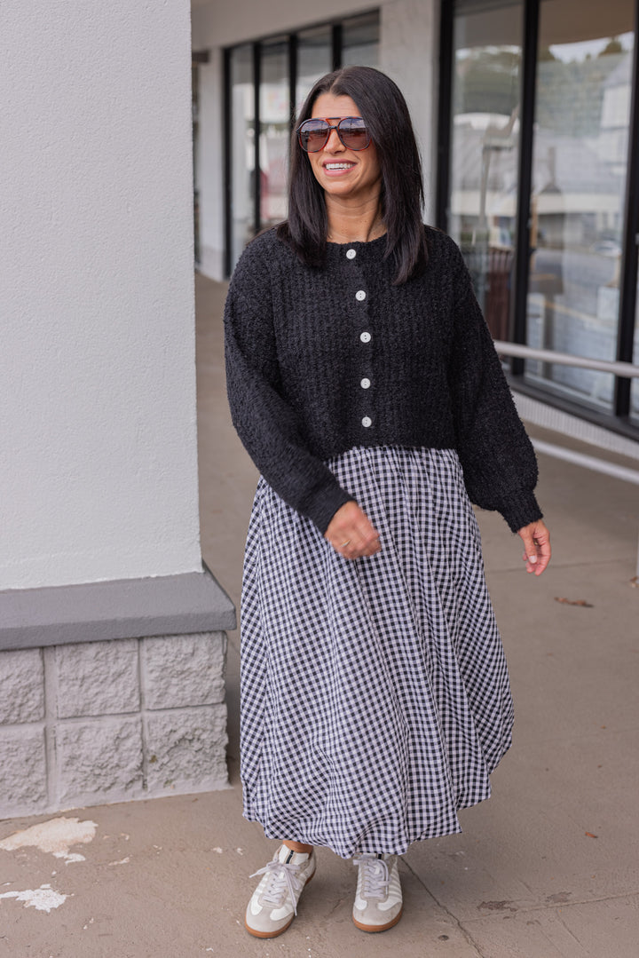 Women's black and white gingham textured midi skirt with bubble hem by Easel showing full front view