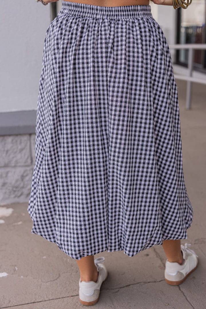 Women's black and white gingham textured midi skirt with bubble hem by Easel showing up close back view