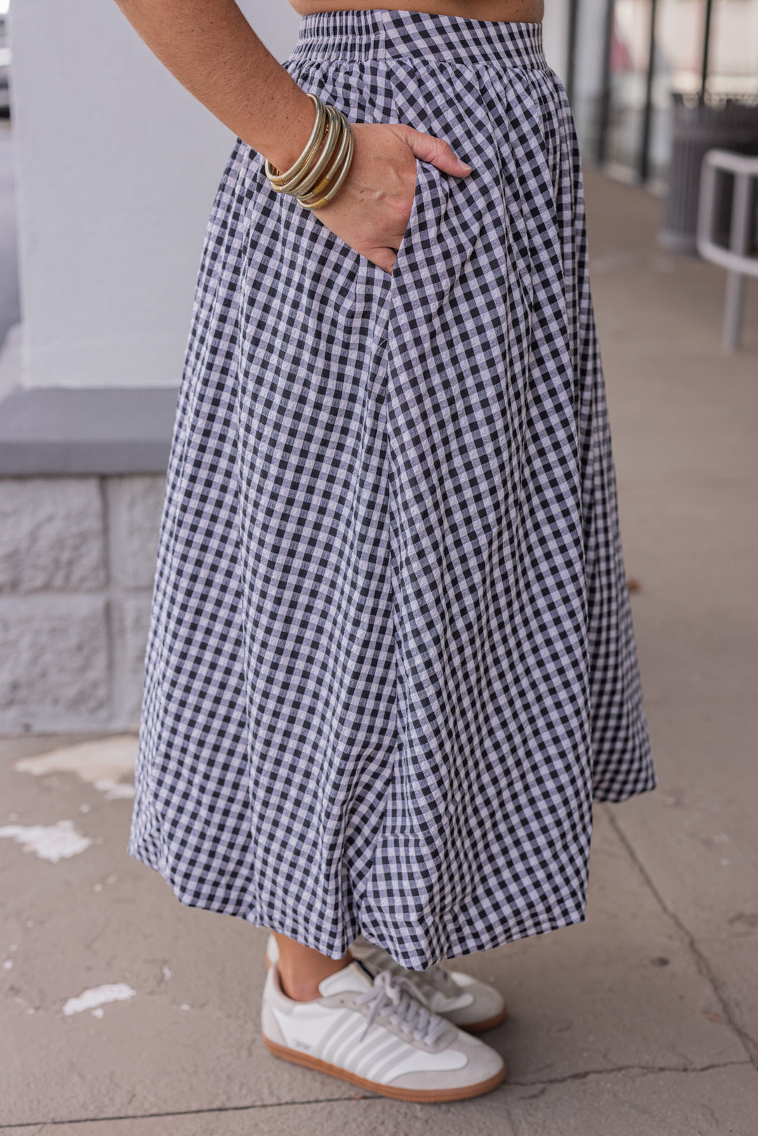 Women's black and white gingham textured midi skirt with bubble hem by Easel showing up close side view